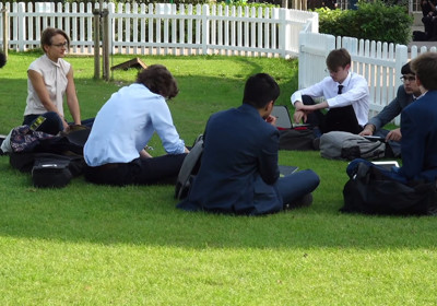 Sixth Formers studying on lawn